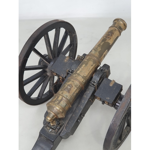 859 - A 20th Century model of a Napoleonic Field Gun, the stained wooden carriage with pair of large spoke... 