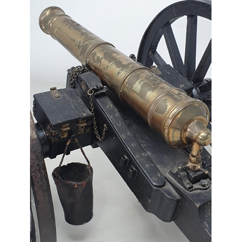 859 - A 20th Century model of a Napoleonic Field Gun, the stained wooden carriage with pair of large spoke... 