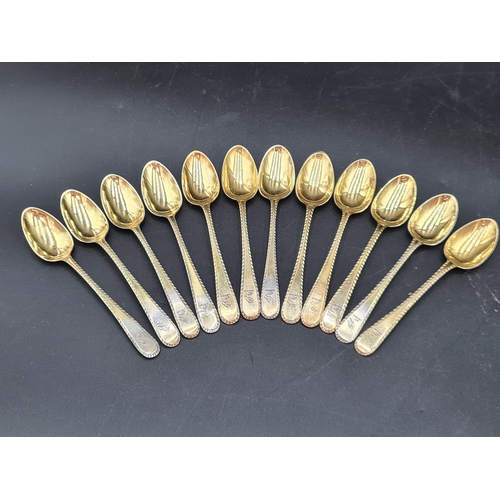 90 - A matched Set of silver-gilt Cutlery engraved bird crests, viz: 12 Table Spoons Onslow pattern, Lond... 