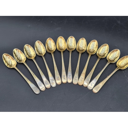 90 - A matched Set of silver-gilt Cutlery engraved bird crests, viz: 12 Table Spoons Onslow pattern, Lond... 