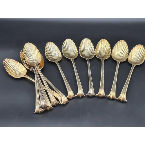 90 - A matched Set of silver-gilt Cutlery engraved bird crests, viz: 12 Table Spoons Onslow pattern, Lond... 