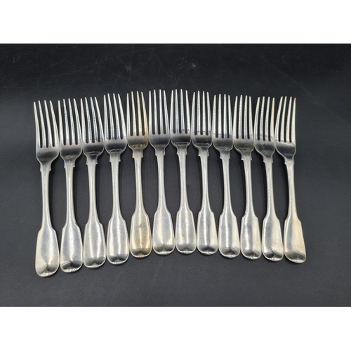 99 - An early 19th Century silver part Set of Cutlery fiddle pattern engraved deer crests, viz: 4 Table S... 