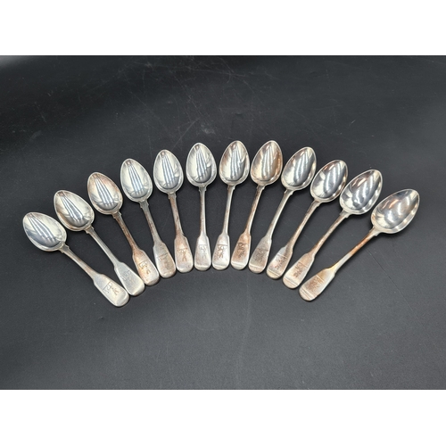 99 - An early 19th Century silver part Set of Cutlery fiddle pattern engraved deer crests, viz: 4 Table S... 