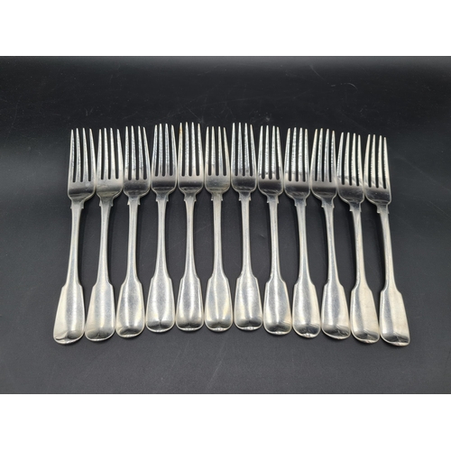 99 - An early 19th Century silver part Set of Cutlery fiddle pattern engraved deer crests, viz: 4 Table S... 