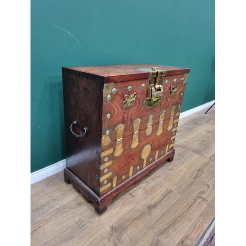 344 - An antique, possibly Moroccan, elm Chest with brass mounts, having fall front and fitted drawers to ... 