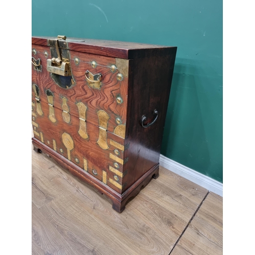 344 - An antique, possibly Moroccan, elm Chest with brass mounts, having fall front and fitted drawers to ... 