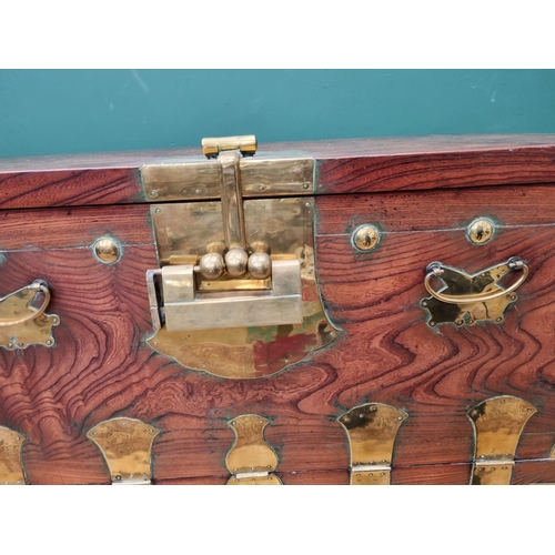 344 - An antique, possibly Moroccan, elm Chest with brass mounts, having fall front and fitted drawers to ... 