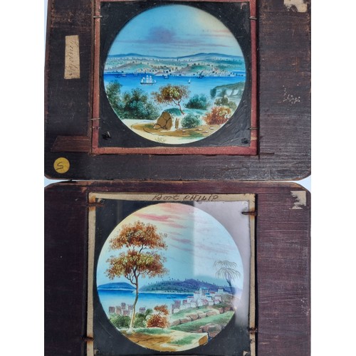 673 - Seven coloured Magic Lantern Slides, chiefly views in Wales including Lighthouse, Castles and one of... 