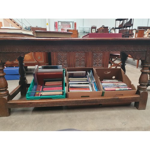 382 - A 17th Century oak Refectory Table with cleated three plank top above leafage arcade carved frieze r... 