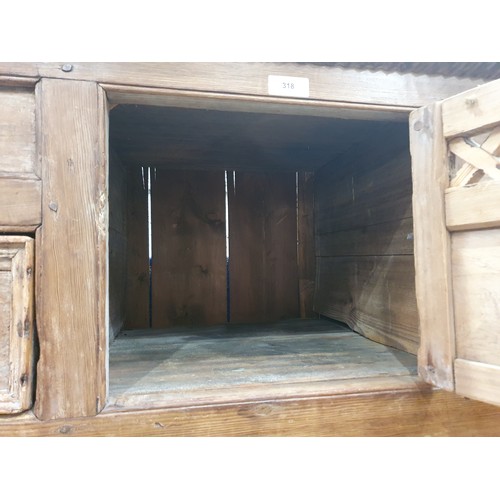 318 - An antique Irish pine Food Cupboard with an arrangement of drawers and cupboard doors and having mou... 