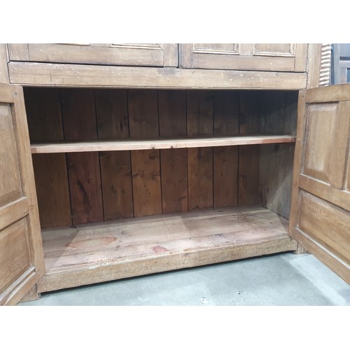 318 - An antique Irish pine Food Cupboard with an arrangement of drawers and cupboard doors and having mou... 