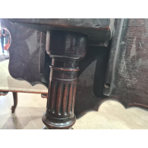 286 - A Georgian mahogany tilt-top Table with shaped dished top on fluted and spiral turned column and car... 