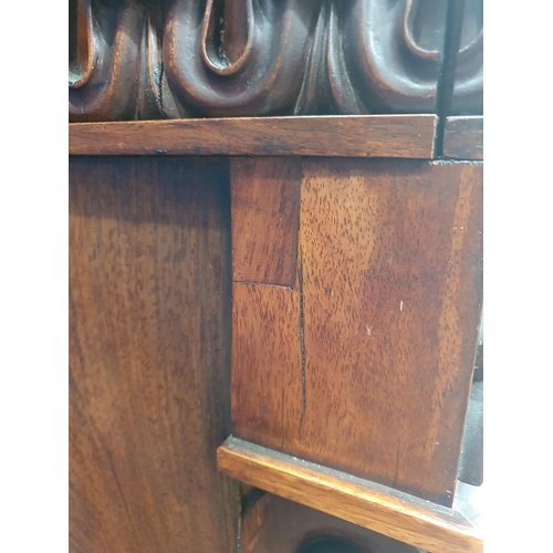 289 - A 19th Century rosewood Display Cabinet with carved frieze above a single glazed door enclosing thre... 