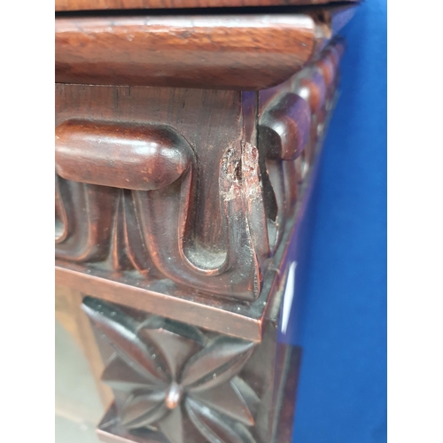 289 - A 19th Century rosewood Display Cabinet with carved frieze above a single glazed door enclosing thre... 