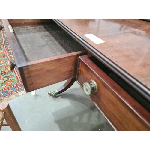 364 - A Regency mahogany Sofa Table in the manner of Gillows fitted two frieze drawers on twin turned colu... 