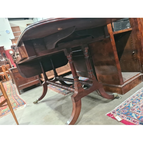 364 - A Regency mahogany Sofa Table in the manner of Gillows fitted two frieze drawers on twin turned colu... 