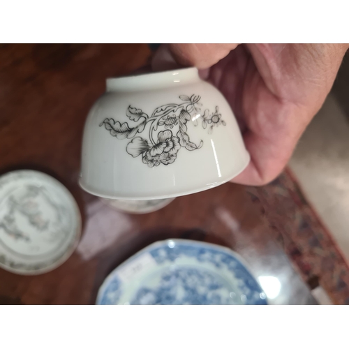 474 - A Chinese grisaille export Tea Bowl and Saucer with leafage borders with central scene of figures in... 