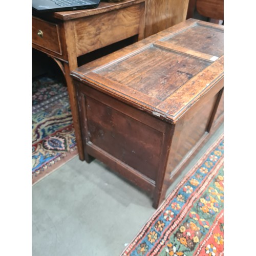 293 - A small 18th Century Oak Coffer with panelled top and front, the interior fitted Candle Box, 3ft 6in... 