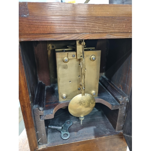 221 - An unusual late 19th Century oak and brass automatic Memorandum Clock, the hinged pediment enclosing... 