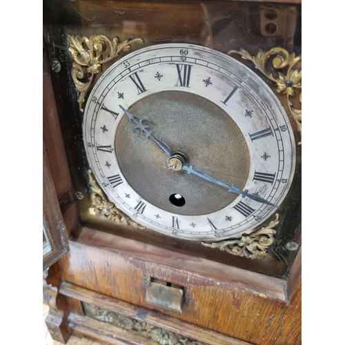 221 - An unusual late 19th Century oak and brass automatic Memorandum Clock, the hinged pediment enclosing... 