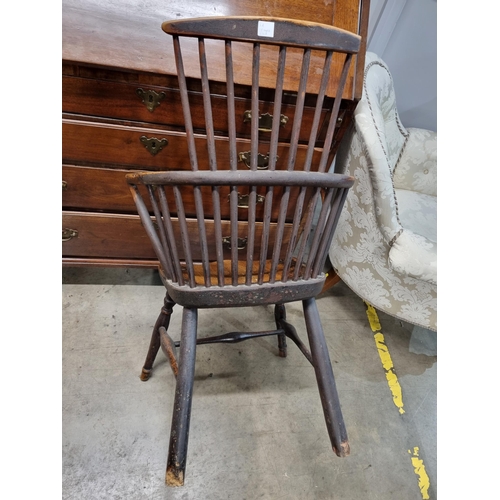 267 - A 19th Century stick back ash and elm Chair with comb top rail raised on turned supports united by H... 