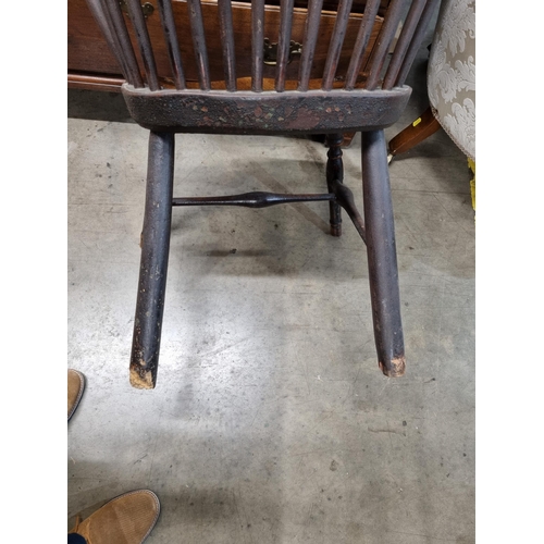 267 - A 19th Century stick back ash and elm Chair with comb top rail raised on turned supports united by H... 