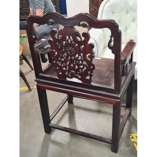 290 - A Chinese hardwood carved Elbow Chair with pierced and carved splat back, solid seat raised on squar... 