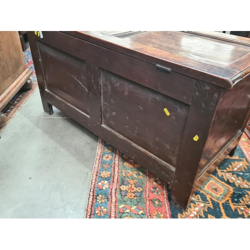 293 - A small 18th Century Oak Coffer with panelled top and front, the interior fitted Candle Box, 3ft 6in... 