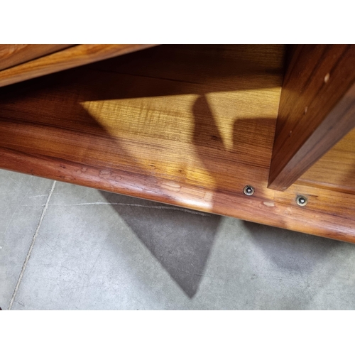 349 - A mid-century Danish teak Sideboard fitted three cupboard doors and four drawers on turned supports ... 