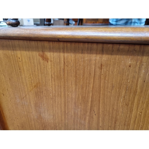 349 - A mid-century Danish teak Sideboard fitted three cupboard doors and four drawers on turned supports ... 