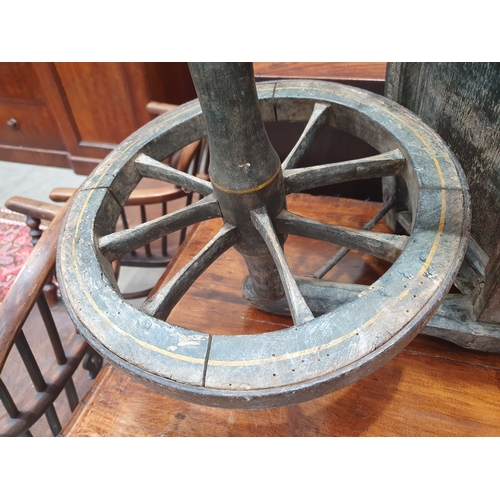 241 - A small painted wooden Wheelbarrow with gilt painted detail 4ft 7in L.