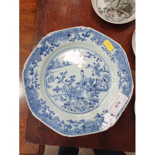 474 - A Chinese grisaille export Tea Bowl and Saucer with leafage borders with central scene of figures in... 