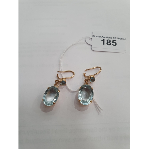 185 - A pair of Aquamarine Ear Pendants each claw-set round stone suspending larger oval-cut stone on wire... 