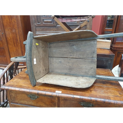 241 - A small painted wooden Wheelbarrow with gilt painted detail 4ft 7in L.