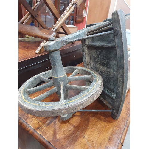 241 - A small painted wooden Wheelbarrow with gilt painted detail 4ft 7in L.