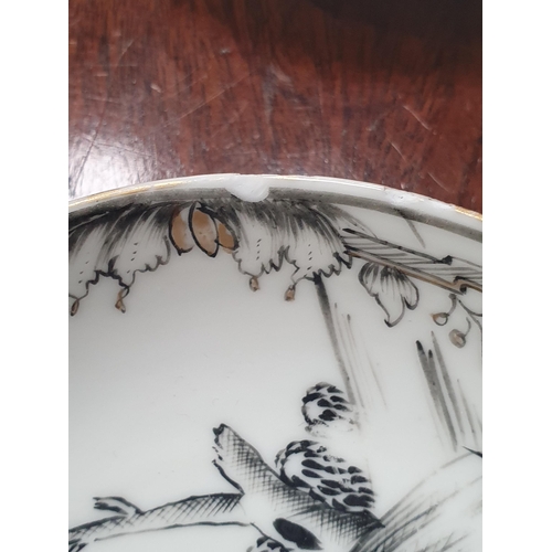 474 - A Chinese grisaille export Tea Bowl and Saucer with leafage borders with central scene of figures in... 