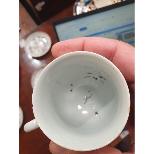 474 - A Chinese grisaille export Tea Bowl and Saucer with leafage borders with central scene of figures in... 