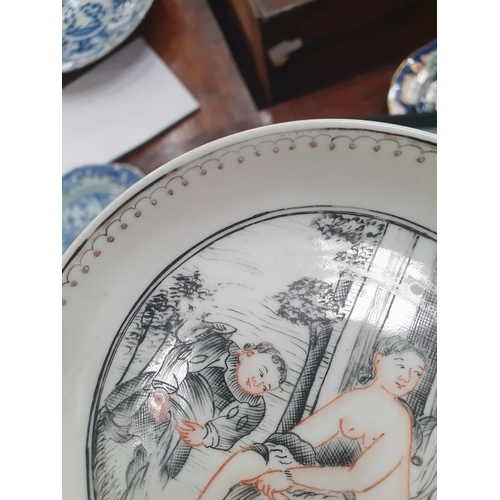 474 - A Chinese grisaille export Tea Bowl and Saucer with leafage borders with central scene of figures in... 