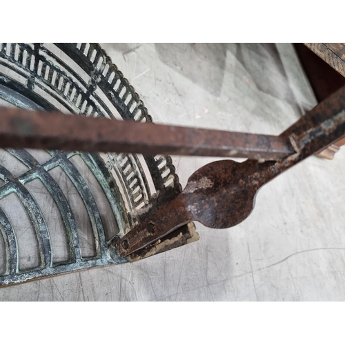 601 - A Georgian brass and iron Kettle Stand of semi-circular form with pierced frieze above three cabriol... 