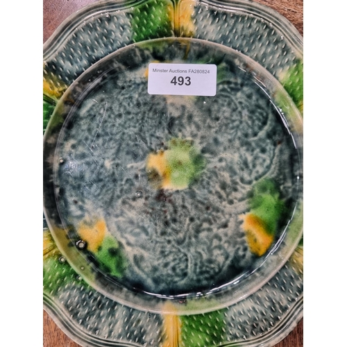 493 - A Whieldon type Plate with shaped and moulded rim and glazes in blue, green and yellow, 9 1/2in diam