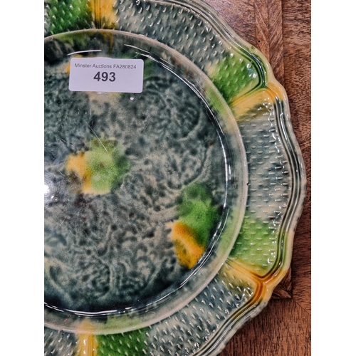 493 - A Whieldon type Plate with shaped and moulded rim and glazes in blue, green and yellow, 9 1/2in diam