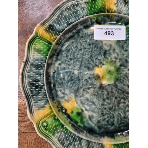 493 - A Whieldon type Plate with shaped and moulded rim and glazes in blue, green and yellow, 9 1/2in diam