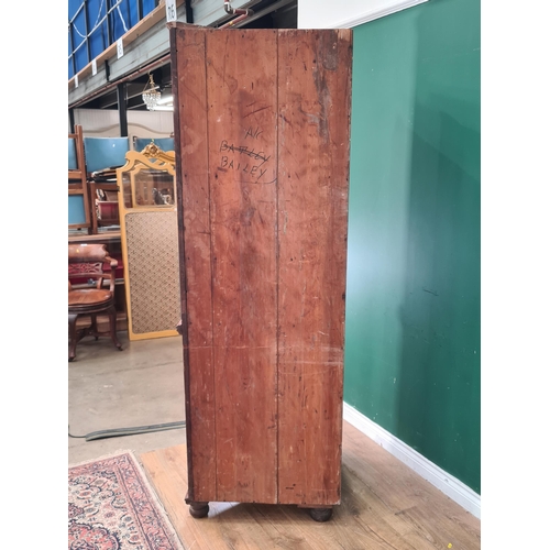 47 - A mahogany Standing Corner Cupboard with glazed top door enclosing three fitted shelves, above panel... 