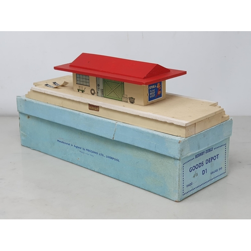 1002 - A boxed Hornby Dublo pre-war Goods Depot with red roof with two loose original type station 'Penrith... 