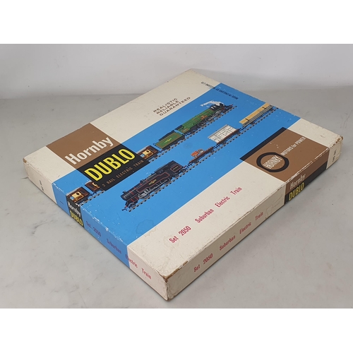 1069 - A boxed Hornby Dublo 2050 Suburban Train Set, contents M, small piece of front coupling missing. Box... 