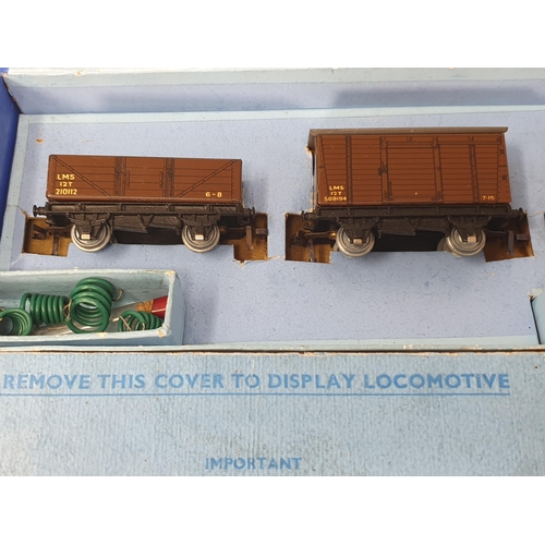 1102 - A boxed Hornby Dublo EDG7 LMS Royal Scot Set, second issue type without gold leaf transfers. Locomot... 