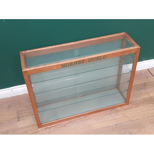 1109 - A rear loading Hornby Dublo Display Cabinet complete with glass shelves and doors, Ex