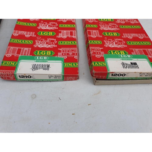 1236 - A box containing 1x 1200E RH Point, 1x 1210E LH Point and various LGB short Straight and Curved Trac... 