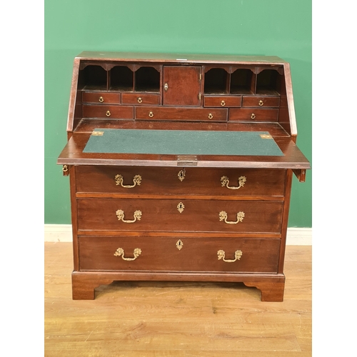 587 - A Georgian mahogany Bureau with fitted interior above four long graduated drawers on bracket support... 