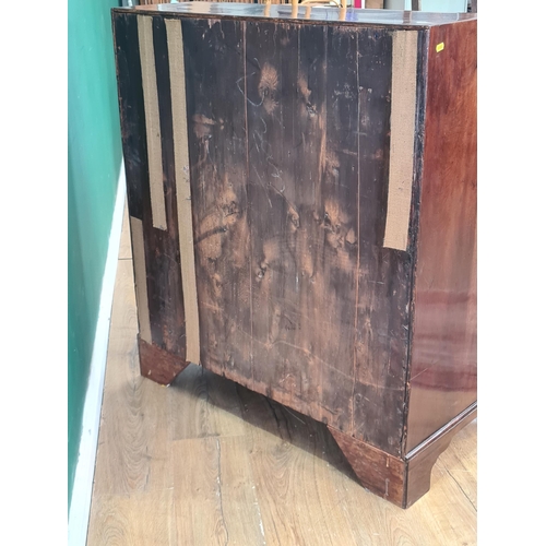 587 - A Georgian mahogany Bureau with fitted interior above four long graduated drawers on bracket support... 